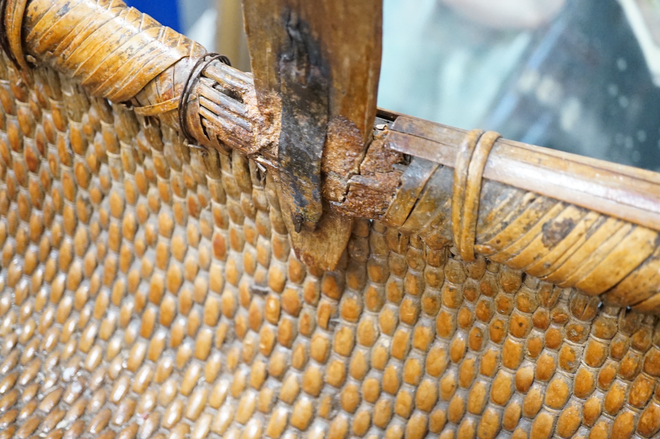 A brass mounted Chinese wicker trug basket. 67cm long